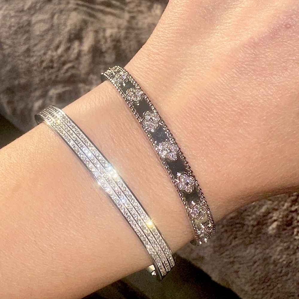 Two piece, silver color, rhinestone and clover bracelets